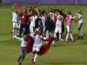 Morocco's players celebrate at the Felix Houphouet-Boigny stadium in Abidjan on November 11, 2017, after the FIFA World Cup 2018 Africa Group C qualifying football match between Ivory Coast and Morocco.
ISSOUF SANOGO / AFP