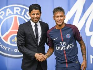 Brazilian superstar Neymar (R) shakes hands with Paris Saint Germain's (PSG) Qatari president Nasser Al-Khelaifi during a press conference at the Parc des Princes stadium on August 4, 2017 in Paris after agreeing a five-year contract following his world record 222 million euro ($260 million) transfer from Barcelona to PSG.
Lionel BONAVENTURE / AFP