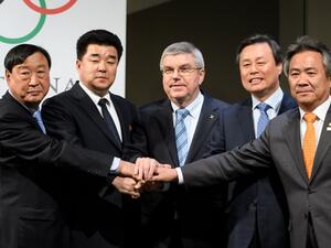 (From L) PyeongChang 2018 Olympics (POCOG) President Lee Hee-beom, North Korea's Sports Minister and Olympic Committee president Kim Il Guk, International Olympic Committee (IOC) President Thomas Bach, South Korean Minister of Culture, Sports and Tourism Do Jong-hwan and South Korea's National Olympic Committee President Lee Kee-heung join their hands as they pose during a signing ceremony at the Olympic Museum on January 20, 2018 in Lausanne. 
Fabrice COFFRINI / AFP