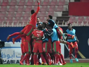 Oman's team celebrate after scoring a goal during the 2017 Gulf Cup of Nations football match between Saudi Arbia and Oman at the Kuwait Stadium in Kuwait City on December 28, 2017.

GIUSEPPE CACACE / AFP