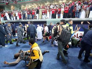 Wounded fans await treatment after a glass barrier broke at the end of the Gulf Cup of Nations 2017 final football match between Oman and the UAE at the Sheikh Jaber al-Ahmad Stadium in Kuwait City on January 5, 2018.
Yasser Al-Zayyat / AFP
