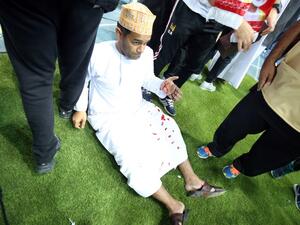A wounded fan awaits treatment after a glass barrier broke at the end of the Gulf Cup of Nations 2017 final football match between Oman and the UAE at the Sheikh Jaber al-Ahmad Stadium in Kuwait City on January 5, 2018.
Yasser Al-Zayyat / AFP