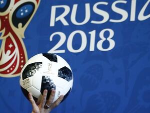 Presenter holds the official match ball for the 2018 FIFA World Cup Russia (Photo: yenisafak.com)
