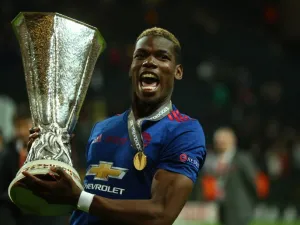 Manchester United's French midfielder Paul Pogba celebrates with the trophy after his team won the UEFA Europa League final football match Ajax Amsterdam v Manchester United on May 24, 2017 at the Friends Arena in Solna outside Stockholm.
Soren Andersson / AFP