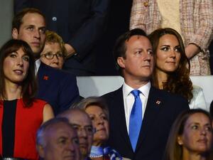 Britain's Prince William and his wife Catherine (back) stand with Britain's Prime Minister David Cameron and his wife Samantha (front) during the opening ceremony of the London 2012 Olympic Games on July 27, 2012 at the Olympic stadium in London. AFP PHOTO / LEON NEAL
LEON NEAL / AFP