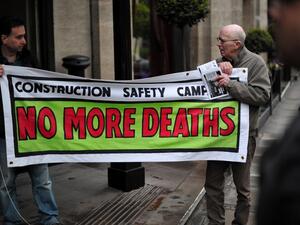 Protesters demonstrate against the perceived exploitation of workers in Qatar, the location of the 2022 World Cup, before a UEFA Congress in central London on May 24, 2013. AFP PHOTO/CARL COURT
CARL COURT / AFP