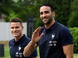 France's forward Kevin Gameiro (L) and defender Adil Rami walk at the French national football team training base in Clairefontaine on May 24, 2016, as part of the team's preparation for the upcoming Euro 2016 European football championships.
FRANCK FIFE / AFP
