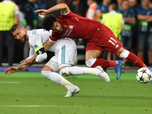  The Liverpool forward's injury saga has taken a bizarre twist, with a fellow countryman looking to sue the Real Madrid skipper who sidelined him 