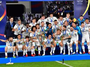 Real Madrid's players celebrate with the trophy after winning the FIFA Club World Cup final football match Spain's Real Madrid vs Abu Dhabi's Al Ain at the Zayed Sports City Stadium in Abu Dhabi, the capital of the United Arab Emirates, on December 22, 2018.
Giuseppe CACACE / AFP