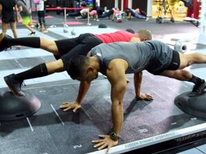 One-legged pushups on top of Bosu balls on the moving REAX Board demands great coordination and balance (Photo: Gulf News)