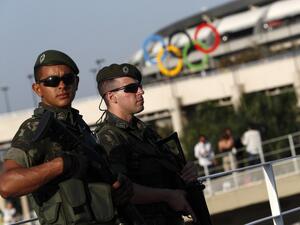 Brazilian security forces stand guard outside the Maracana stadium in Rio de Janeiro on August 5, 2016. A vast security blanket of 85,000 military personnel and police -- twice the number on duty at the 2012 London Games -- are draped over the city to ward off the threat of street crime and terror attacks.
Adrian DENNIS / AFP