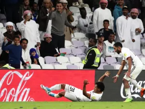 UAE's al-Jazira club player Romarinho (L) celebrates with his teammates and fans after scoring a goal during their FIFA Club World Cup UAE 2017 first round football match between al-Jazira and Auckland City FC at the Hazza Bin Zayed Stadium on December 6, 2017 in Al-Ain.
KARIM SAHIB / AFP