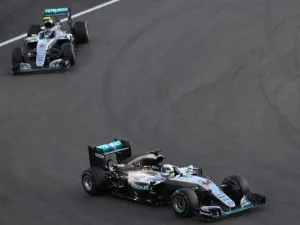 Mercedes AMG Petronas F1 Team's British driver Lewis Hamilton (R) and his teammate German driver Nico Rosberg steer their cars during the Abu Dhabi Formula One Grand Prix at the Yas Marina circuit on November 27, 2016. KARIM SAHIB / AFP