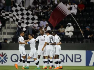 Al-Sadd's forward Baghdad Bounedjah is congratulated by his teammate after scoring during the AFC Champions League football match between Qatar's al-Sadd and UAE's al-Wasl at the Jassim bin Hamad Stadium in Doha, on April 2, 2018.
KARIM JAAFAR / AFP