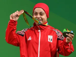 Egypt's Sara Ahmed poses with her bronze medal on the podium of the Women's 69kg weightlifting competition at the Rio 2016 Olympic Games in Rio de Janeiro on August 10, 2016.
GOH Chai Hin / AFP