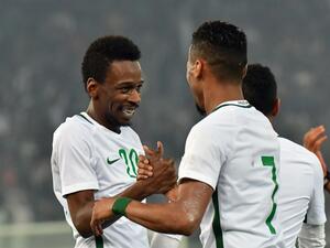 Saudi's Mukhtar Flata (L) celebrates with teammate Salman al-Muasher (R) after scoring during the 2017 Gulf Cup of Nations football match between Kuwait and Saudi Arabia at the Sheikh Jaber al-Ahmad Stadium in Kuwait City on December 22, 2017.
GIUSEPPE CACACE / AFP