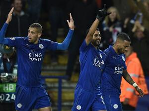Leicester City's Algerian striker Islam Slimani (L) reacts after Leicester City's Algerian midfielder Riyad Mahrez (C) scored his team's first goal during the UEFA Champions League group G football match between Leicester City and FC Copenhagen at the King Power Stadium in Leicester, central England on October 18, 2016.
OLI SCARFF / AFP