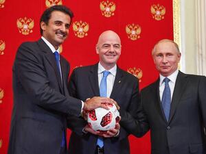 (From L) Emir of Qatar Sheikh Tamim bin Hamad Al-Thani, FIFA President Gianni Infantino and Russian President Vladimir Putin pose for a photography during a symbolic transfer of the authority to Qatar to host the World Cup 2022 at the Kremlin in Moscow on July 15, 2018.
Yuri KADOBNOV / POOL / AFP