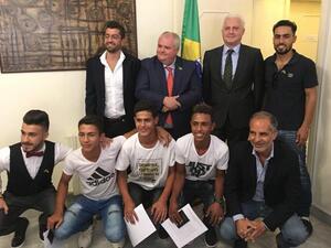 Brazilian Ambassador to Jordan Francisco Carlos Soares Luz pose for a group photo with young Syrian refugees at the embassy on Sunday (Photo: Camille Dupire)