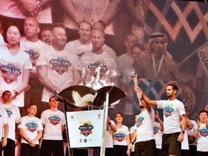 Athletes Daniel and Yassir light and carry the torch at the closing ceremony of the Host Town Program in Dubai preceding the Special Olympics World Games Abu Dhabi 2019 at Global Village on 10th March, 2019. (Photo: Clint Egbert/Gulf News)
