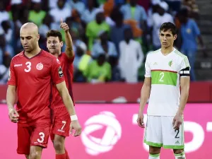 Tunisia's midfielder Youssef Msakni (L) gives a thumbs-up next to Algeria's defender Aissa Mandi at the end of the 2017 Africa Cup of Nations group B football match between Algeria and Tunisia in Franceville on January 19, 2017.
KHALED DESOUKI / AFP