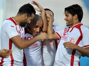 Tunisian players hug their teammate striker Wahbi Khazri(2nd L) after he scored during a qualifying football match against Liberia for the Africa Nations Cup 2017 on September 4, 2016 in Ben Jannet Olympic stadium in Monastir.
SALAH HABIBI / AFP