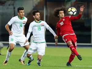 UAE's Omar Abdulrahman (R) kicks the ball as Iraq's Mahdi Kamel (C) and Amjad Attwan defend during the 2017 Gulf Cup of Nations semi-final football match between Iraq and UAE at the Sheikh Jaber al-Ahmad Stadium in Kuwait City on January 2, 2018.
Yasser Al-Zayyat / AFP