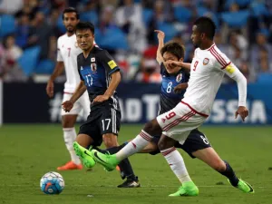 UAE's defender Abdulaziz Hussain Haikal (R) passes the ball as he is marked by Japan's forward Genki Haraguchi (2nd-R) during the FIFA World Cup 2018 qualifier between UAE and Japan at Hazza Bin Zayed Stadium in Al-Ain on March 23, 2017.
NEZAR BALOUT / AFP