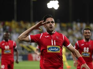 Kamal Kamyabinia celebrates after scoring