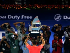 Stanislas Wawrinka of Switzerland poses with his trophy in front of journalists after beating Marcos Baghdatis of Cyprus in their ATP final tennis match of the Dubai Duty Free Tennis Championships on February 27, 2016. Wawrinka won 6-4, 7-6 (15/13).

MARWAN NAAMANI / AFP