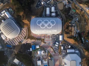 This picture taken on December 28, 2017 in Gangneung shows venues for the 2018 Pyeongchang Winter Olympics including Gangneung Ice Arena (L), Gangneung Oval (C) and Gangneung Hockey Centre (bottom R). Thousands of avid speed skating fans will pack the futuristic Gangneung Oval for the Olympic tournament next month. But afterwards one suggestion is for the cavernous steel-grey structure to host frozen fish.
Yelim LEE / AFP
