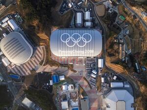 This picture taken on December 28, 2017 in Gangneung shows venues for the 2018 Pyeongchang Winter Olympics including Gangneung Ice Arena (L), Gangneung Oval (C) and Gangneung Hockey Centre (bottom R). Thousands of avid speed skating fans will pack the futuristic Gangneung Oval for the Olympic tournament next month. But afterwards one suggestion is for the cavernous steel-grey structure to host frozen fish.
Yelim LEE / AFP
