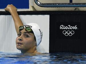 Refugee Olympic Team's Yusra Mardini takes part in the Women's 100m Butterfly heat during the swimming event at the Rio 2016 Olympic Games at the Olympic Aquatics Stadium in Rio de Janeiro on August 6, 2016.
Martin BUREAU / AFP