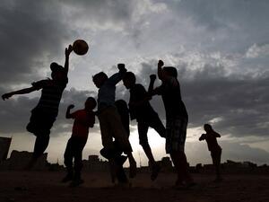 Yemeni children play football in a field in the capital Sanaa on June 10, 2014. AFP PHOTO/MOHAMMED HUWAIS
MOHAMMED HUWAIS / AFP
