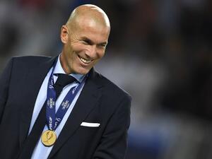 Real Madrid's French coach Zinedine Zidane smiles with his medal after winning the UEFA Super Cup football match between Real Madrid and Manchester United on August 8, 2017, at the Philip II Arena in Skopje.
Dimitar DILKOFF / AFP