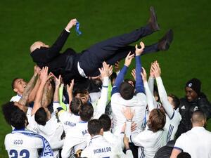 Real Madrid head coach Zinedine Zidane is thrown into the air by Real Madrid players after winning the Club World Cup football final match against Kashima Antlers of Japan at Yokohama International stadium in Yokohama on December 18, 2016.
Toru YAMANAKA / AFP