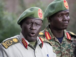 Former Sudan People's Liberation Army (SPLA) chief of general training and former in-opposition general Dau Athorjang (L) speaks during a press conference, pledging his allegiance to the SPLA on July 10, 2016 in Juba. (AFP/Charles Atiki Lomodong) Former Sudan People's Liberation Army (SPLA) chief of general training and former in-opposition general Dau Athorjang (L) speaks during a press conference, pledging his allegiance to the SPLA on July 10, 2016 in Juba. (AFP/Charles Atiki Lomodong)