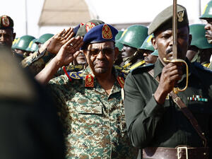 Sudanese President Omar al-Bashir salutes during the joint Sudan and Saudi Arabia airforce drill near Khartoum. (AFP) 
