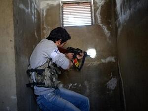 A Kurdish fighter the northern Syrian city of Aleppo on April 14, 2013. (DIMITAR DILKOFF/AFP/Getty Images)