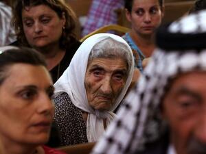 Christians gather for a church service in Iraq.  While in previous years Iraq's diverse ethnic and religious groups largely coexisted, recent conflicts have worked to divide Iraqis along stark sectarian lines. (AFP/File)