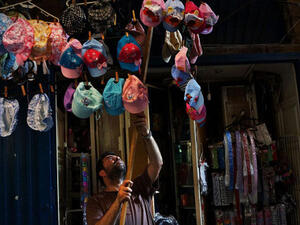 A man closes-up his shop in a market in Tripoli, Lebanon's second largest city, has suffered from the spillover of Syria's two-year-old war. Currently the Lebanese government officially hosts 546,000 Syrians with an estimated additional 500,000 who have not registered with the United Nations. . (Photo by Spencer Platt/Getty Images)