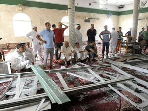 Locals examine the damage to Imam Ali mosque in Qatif, Saudi Arabia following a Friday suicide bomb attack that left at least 15 dead.  (AFP/File)