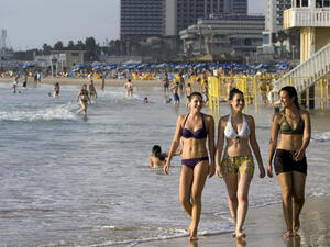 Israeli women enjoy the beach in Tel Aviv.  (AFP/Jonathan Nackstrand)