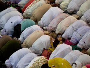 Women perform prayers at a mosque in Kuala Lumpur, Malaysia. (AFP/Manan Vatsyayana)