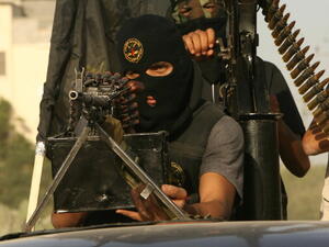 Masked fighters from the Palestinian Islamic Jihad's military wing 'Saraya Al-Quds' or 'Jerusalem Brigades' take part in a military parade in the streets of the southern Gaza Strip town of Rafah on October 28, 2010 [Getty Images]