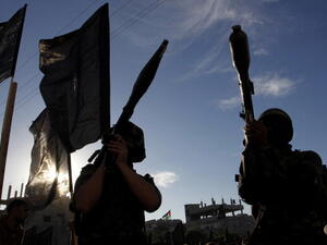 Palestinian militants of the Islamic Jihad hold rocket propelled grenades (RPG) as they take part in a rally against Israel in the southern Gaza Strip town of Rafah, on October 24, 2013. [Photo credit: SAID KHATIB/AFP/Getty Images]