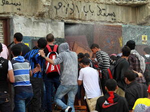 Egyptian students of al-Azhar University block the access to an administration building during an anti-army protest on October 30, 2013 at the university in Cairo. [KHALED KAMEL/AFP/Getty Images]