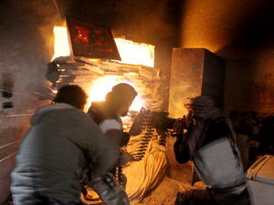 Rebel fighters from the Free Syrian Army fire a heavy machine gun during fighting against government forces on November 18, 2013 in the Salah al-Din neighbourhood of the northern Syrian city of Aleppo. (Getty Images)