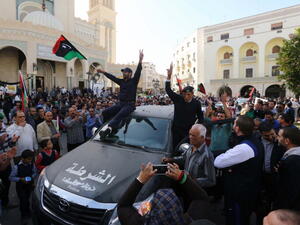 attend a demonstration alongside Libyan civilians in Tripoli against the presence of militia in the capital and in support of the army and police on November 19, 2013. [MAHMUD TURKIA/Getty Images]