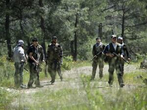 مقاتلون من المعارضة يتدربون في جبل التركمان/أ.ف.ب